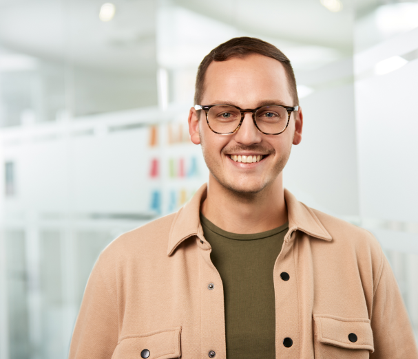 smiling man looking downwards